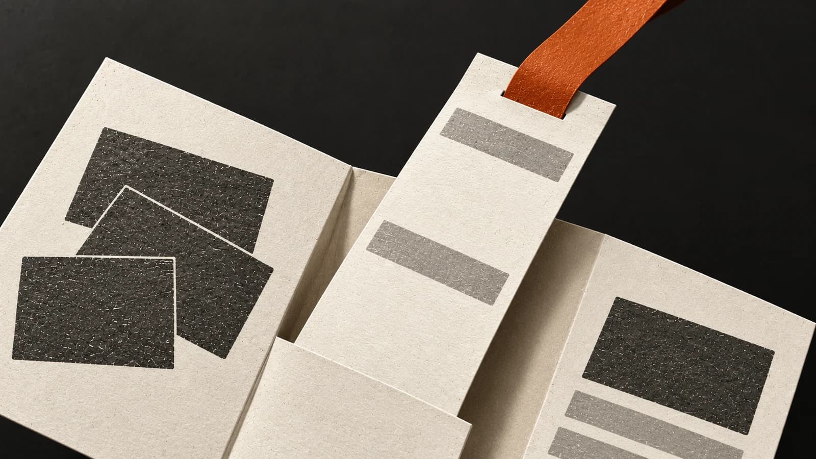 An amber ribbon lifts one report strip from a diagonally folded ivory research guide against charcoal.